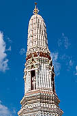 Bangkok Wat Arun - Detail of the niches of each minor prang with statues of Nayu, the god of wind, on horseback. 